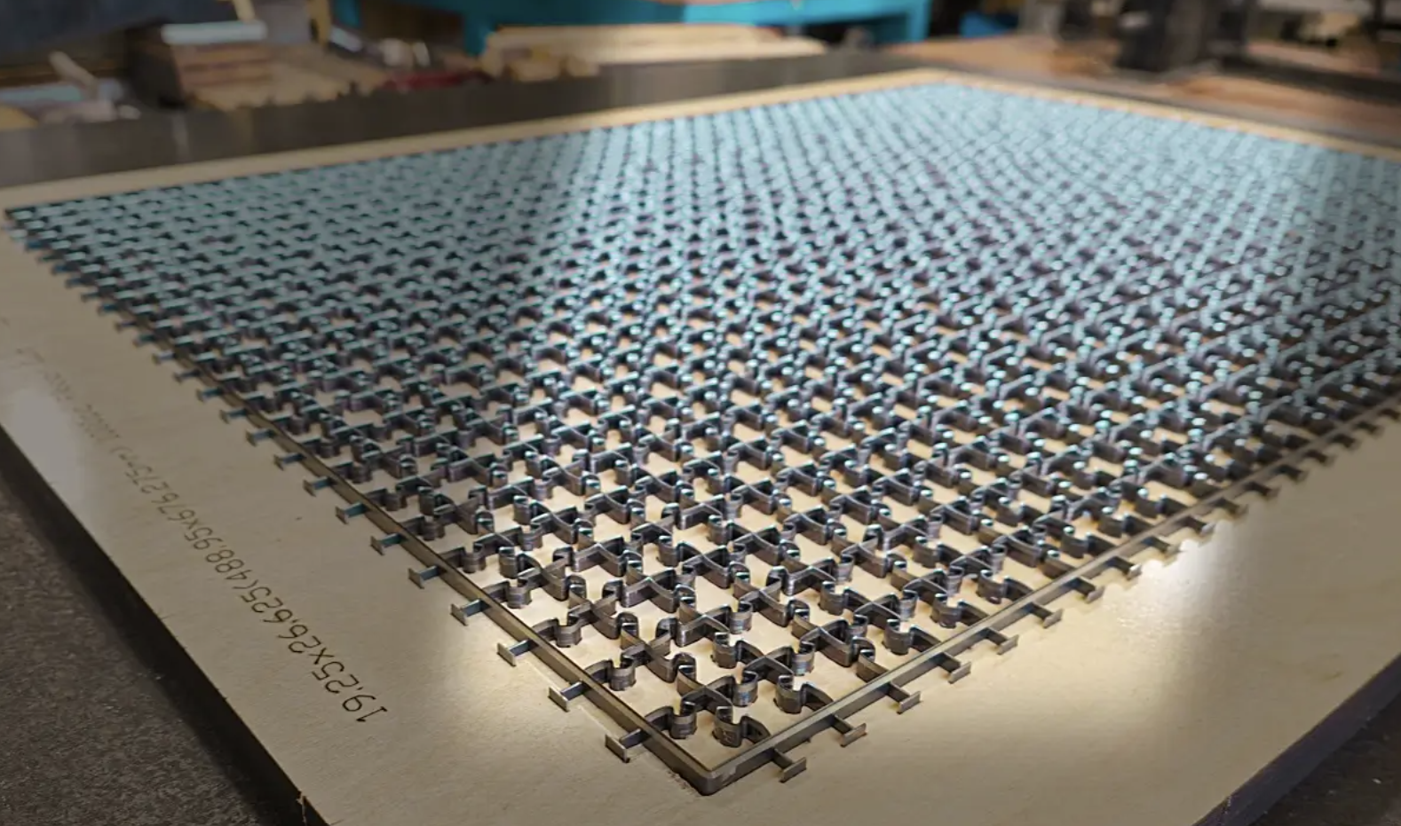 Puzzle die-cut patterns shown on a die board used in custom jigsaw puzzle manufacturing