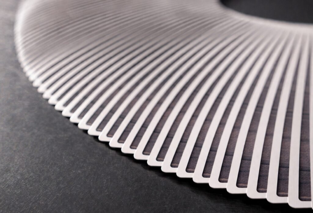 Fanned playing cards showing consistent edge spacing and air gaps demonstrating shuffle performance and surface friction